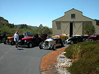 Jeff Bates inspecting roadsters at Jim Eckford's