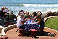 Guest enjoying tacos with the pounding surf as a backdrop.