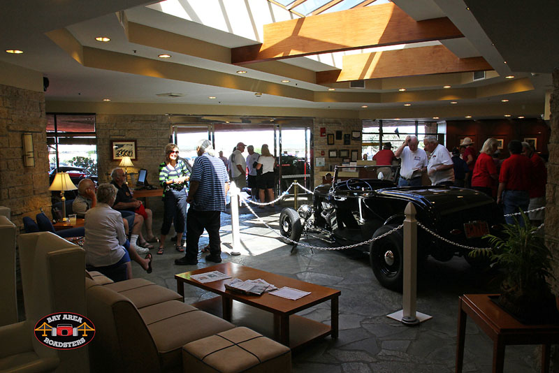 LAR member roadster within the lobby welcoming guests.